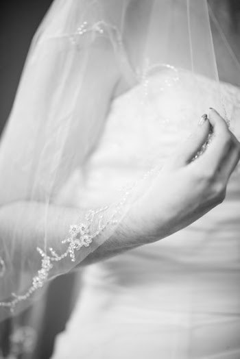 Monochrome Photo of Woman Holding Her Veil