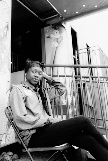 Monochrome Photo Of Woman Sitting On Chair
