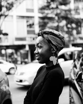 Monochrome Photo of Woman Smiling Wearing Earring