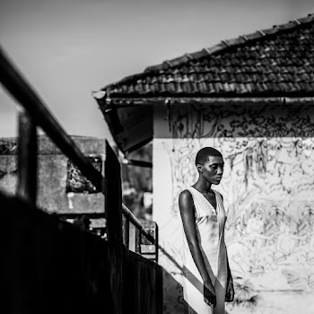 Monochrome Photo Of Woman Standing Near Handrail