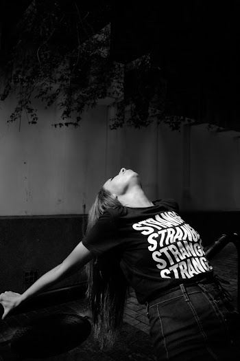 Monochrome Photo Of Woman Wearing Black Printed Shirt