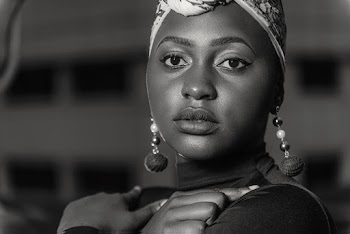 Monochrome Photo of Woman Wearing Earrings