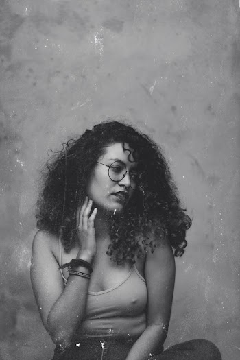 Monochrome Photo of Woman Wearing Eyeglasses