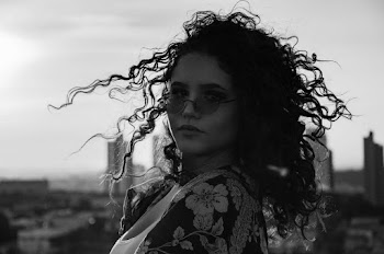 Monochrome Photo of Woman Wearing Sunglasses