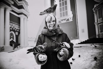Monochrome Photo of Woman With Perched Pigeons on Her