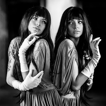 Monochrome Photo of Women Looking at Each Other