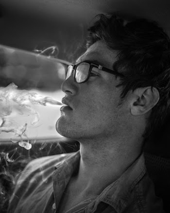 Monochrome Photography of Man Smoking