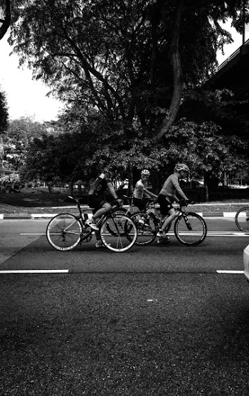 Monochrome Photography of People On Bicycle