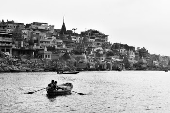 Monochrome Photography of Two Persons Riding Boat