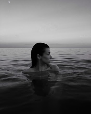 Monochrome Photography of Woman In Water