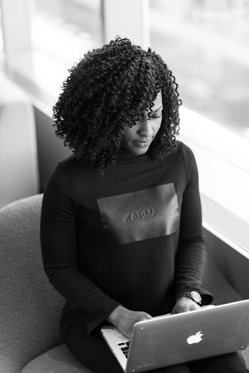 Monochrome Photography of Woman Using Laptop