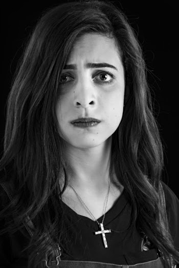 Monochrome Photography of Woman Wearing Cross Necklace
