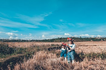 Mother And Daughter At The Field