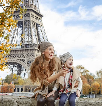 mother and daughter on embankmen in Paris pointing on something