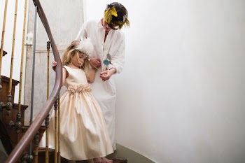 mother and daughter walking down the stairs