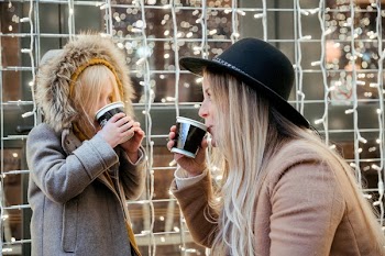 Mother Daughter Sharing Hot Beverages