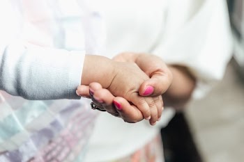 Mother Holding Babies Hand