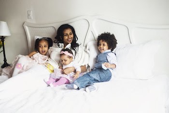 Mother Relaxing With Her Kids