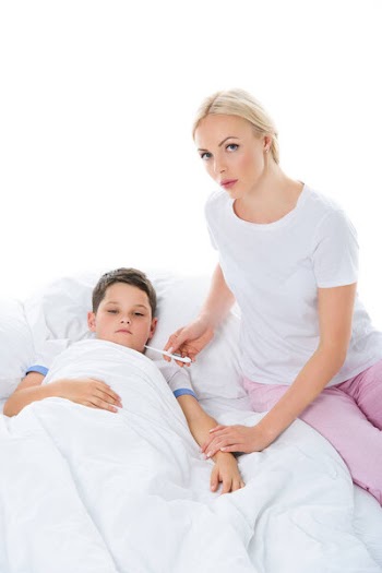 Mother with electronic thermometer sitting near sick son, isolated on white