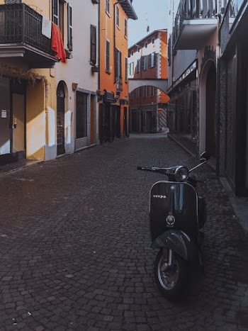Motor Scooter Parked Beside Building
