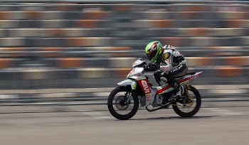 Motorcycle Racer on Silver Motorcycle