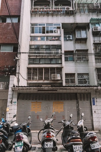 Motorcycles Parked In Front Of A Building