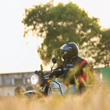 Motorcyclist Sitting on Gray Motorcycle Outdoors