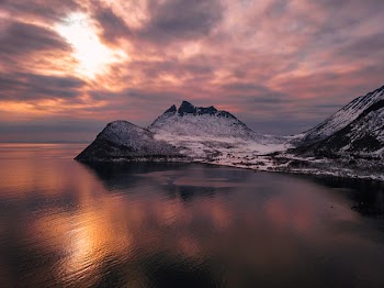 Mountain Beside Ocean During Golden Hour