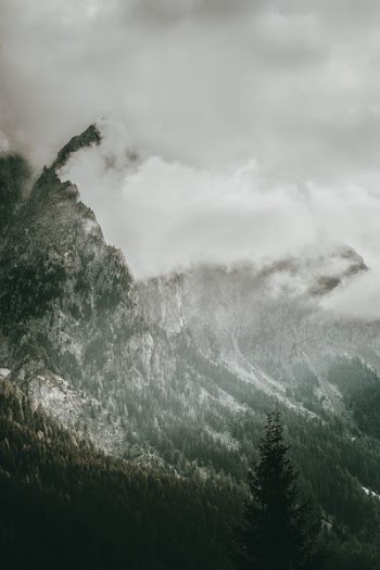 mountain covered by snow at daytime