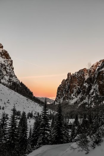 mountain covered by snow at golden hour