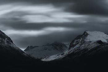 mountain covered in snow at night