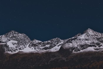 Mountain Covered With Snow During Nighttime