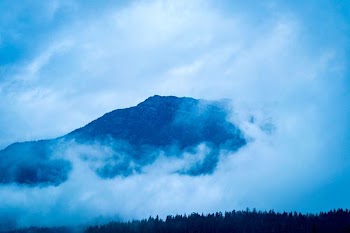 mountain covered with white clouds
