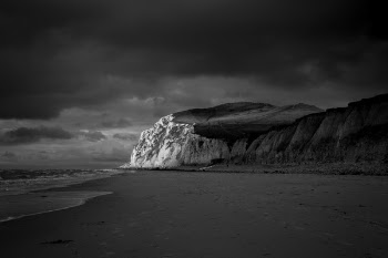 Mountain Near Beach Shore Under Dark Cloudy Sky