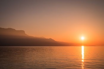 mountain near body of water