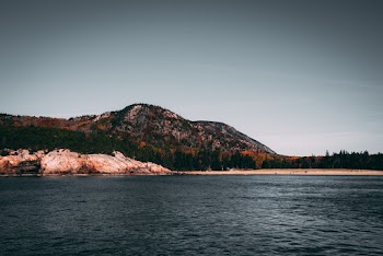 Mountain Near Body Of Water