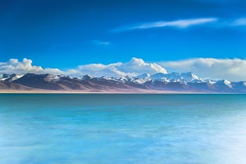 mountain near on body of water photography
