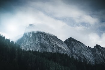 Mountain Peak Reaching The Clouds
