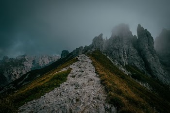 mountain peak trail surrounded with fogs