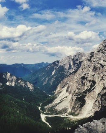 mountain range under clouds