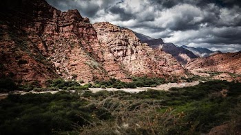 mountain ranges and river with grass