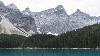 mountain ranges near body of water during daytime