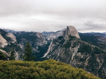 mountain ranges under cloudy sky during daytime