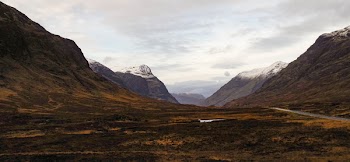 Mountain Ranges With Cloudy Sky