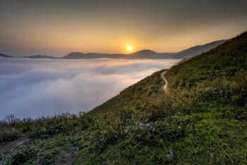 Mountain Ridge Overlooking Sea of Clouds during Golden Hour