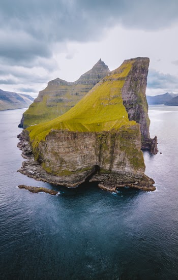 Mountain Rock on Body of Water