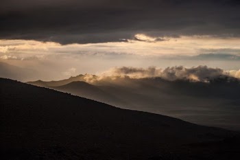 mountain under gray sky