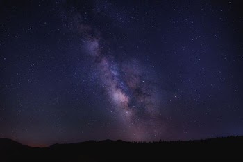 mountain under purple sky
