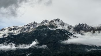 mountain under white cloudy sky