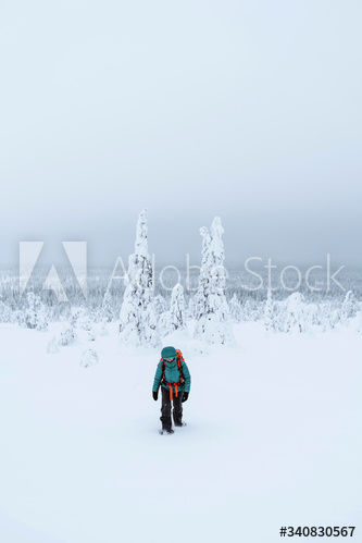Mountaineer trekking in the snow at Lapland, Finland
